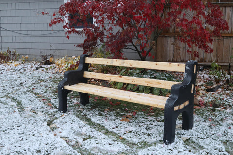 DIY Bench Ends Kit For Outdoor And Patio Benches, black finish, assembled with 2x4s in snowy garden, fall season