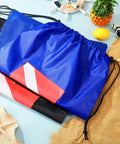 Six Pack Mesh Gear Bags for Snorkel Gear and Swim Equipment Oversized 18 by 26 Inches Nylon Drawstring Duffle Bags on sandy beach
