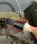 Oriflo Parts Brush with Hose; flow-through washer brush, ivory handle, black bristles, red ORIFLO logo.