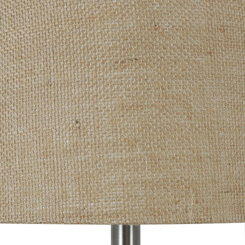 Close-up of burlap drum shade on Blue Embossed Glass Table Lamp With Jute Wrapped Base And Tall Silver Finial, natural texture detail.