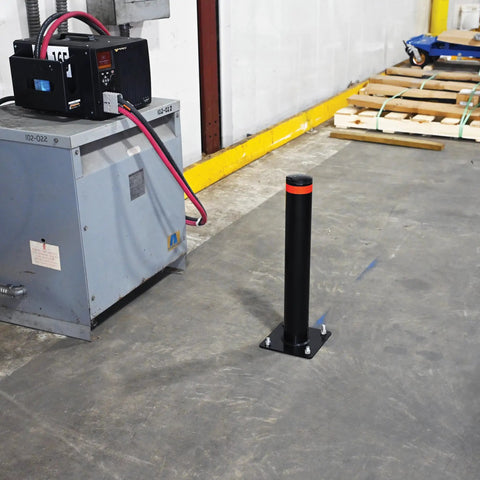 Badass 24 Inch Steel Garage Safety Bollard Wall Defender Pipe Guard With Pre Drilled Mounting Holes Matte Black Finish on concrete floor.