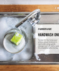 Gotta Have This Knockout 15 Piece Kitchen Knife Set Featuring Hella Sharp High Carbon Stainless Steel Blades in soapy sink.