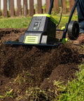 Corded Electric Garden Tiller Cultivator With 12.5 Amp Motor 16 Inch Tilling Width 8 Inch Maximum Depth Six Steel Tines in use