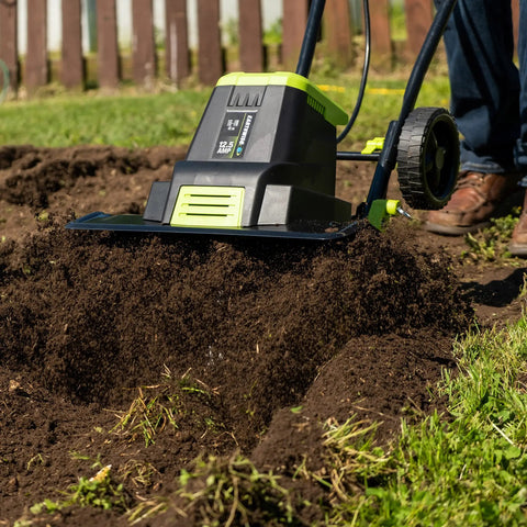 Corded Electric Garden Tiller Cultivator With 12.5 Amp Motor 16 Inch Tilling Width 8 Inch Maximum Depth Six Steel Tines in use