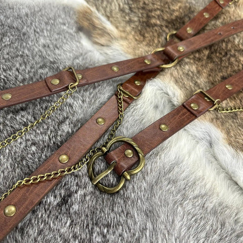 Close-up of Snag This Fresh Medieval Faux Leather Wrap Belt To Kick Up Your Vintage Look With Adjustable Chain Details and a buckle.