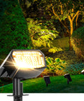63 LED Solar Spotlight Lights Outdoor With 3000K Daylight Super Bright 3 Lighting Modes IP65 installed in garden landscape