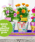 Paint And Plant Stoneware Flower Garden Kit For Kids 6 To 12, colorful painted pots with blooming marigolds, cosmos, and zinnias