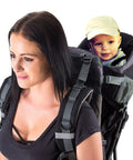 Woman carrying a baby in Outdoorsy Hiking Baby Carrier Backpack For Safe Comfortable Toddler And Baby Transport with sun hood.