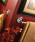 Yorkshire 18 Inch Towel Bar In Chrome 5318CH installed on red bathroom wall with towels and floral decoration