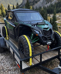 Heavy Duty Ratchet Straps 8 Pack 2 Inches By 15 Feet Featuring Bulletproof 4500 Pound Breaking Strength For Secure Cargo Tie Downs On Hotshot Trucks securing UTV on trailer with yellow straps.