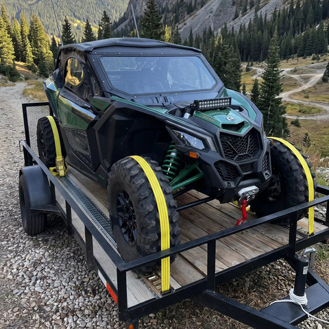 Heavy Duty Ratchet Straps 8 Pack 2 Inches By 15 Feet Featuring Bulletproof 4500 Pound Breaking Strength For Secure Cargo Tie Downs On Hotshot Trucks securing UTV on trailer with yellow straps.