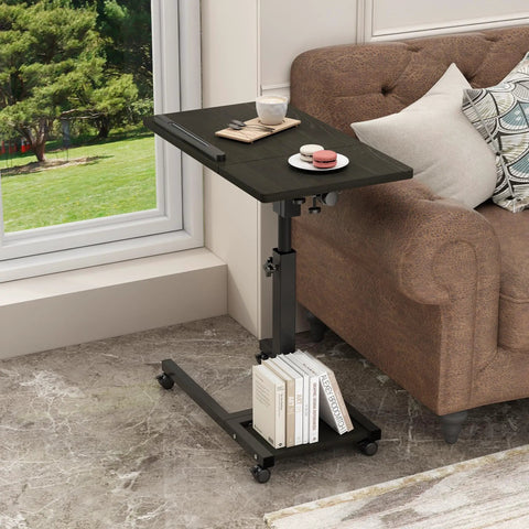 Mobile Adjustable Height Laptop Desk On Wheels Tiltable Work Table For Laptop Or Notebook beside sofa with books on bottom rack