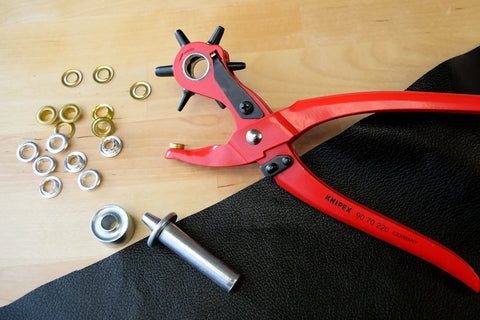 Revolving Punch Pliers Kit With Six Interchangeable Punches For Leather, Textile, And Plastic 20 25 30 35 40 50 mm on table