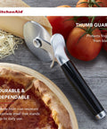 Pizza Cutter Roller Wheel With Sharp Blade For Crusts And Pies, Built In Finger Guard And Comfort Grip, next to cheese and tomatoes.