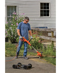 Man using 3-In-1 Electric Lawn Mower Weed Eater And Edger For Small Yards Corded 12-Inch 6.5 Amp Powerdrive Motor Lightweight Push
