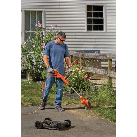 Man using 3-In-1 Electric Lawn Mower Weed Eater And Edger For Small Yards Corded 12-Inch 6.5 Amp Powerdrive Motor Lightweight Push