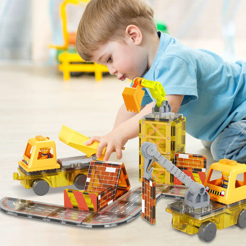 Child playing with Magnetic Construction Vehicle Tiles Set 5 In 1 Buildable Crane Excavator Dump Truck Ladder Truck Backhoe With Two Car Bases