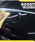 Person polishing glossy car surface with cloth, showing use of Ultra Cut Car Compound For Heavy Scratches And Swirls Removal.