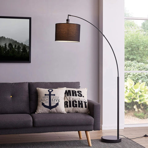Tall 71 inch arc floor lamp with black fabric shade and steel base, modern standing light for living room over couch.