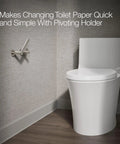 Composed Wall Mounted Pivoting Toilet Paper Holder in Vibrant Polished Nickel next to white toilet in bathroom corner