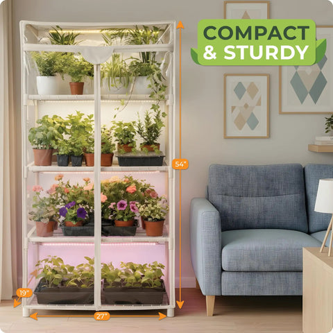 Indoor Greenhouse With Grow Light For Home Gardening, 4 Tier Mini Grow Tent With Zip PVC Cover in living room next to sofa.
