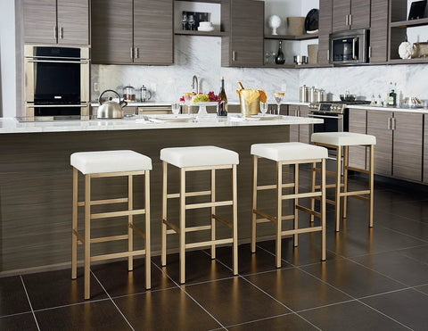 Backless Bar Stool With Gold Frame And White Vinyl Cushioned Seat 30 Inch Counter Height in modern kitchen setting