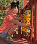 Child playing with Yellow Tic Tac Toe Spinner Activity Panel For Swing Sets, Backyard Play Accessory, Durable UV Protected Plastic