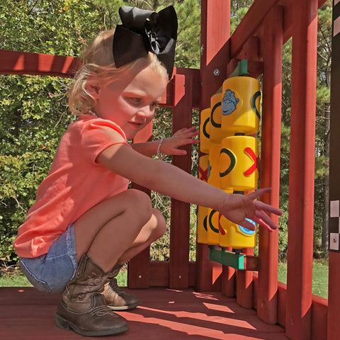 Child playing with Yellow Tic Tac Toe Spinner Activity Panel For Swing Sets, Backyard Play Accessory, Durable UV Protected Plastic