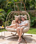 Double Hanging Egg Chair With Stand For Patio Or Balcony Oversized Two Person Outdoor Swing With Thick Cushions And All Weather Wicker Loveseat Beige
