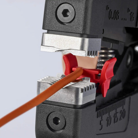 Close-up of Precise Insulation Stripper With Parabolic Blades And Auto Pullback, cutting wire with length markings visible