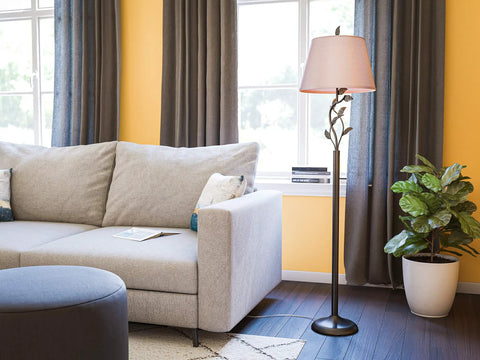 Rustic Oil Rubbed Bronze Floor Lamp With Leaf Finial And Gold Tapered Shade, 58.75 Inch Tall, in living room by sofa