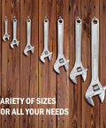 Heavy Duty 15 Inch Adjustable Wrench Built Tough With Drop Forged Steel, Chrome Plated Finish, array of different sizes on wood.