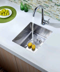 Undermount Single Bowl Bar Sink In Polished Satin Finish with running faucet and lemons in 18 by 10 chrome nickel stainless steel, 18 gauge 304 grade