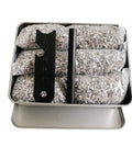 Emergency Fire Starter Kit With Pre Shaved Magnesium, 3.15 Inch Ferro Rod, And 4 Inch Waxed Rope In Waterproof Tin displayed open