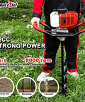 Person operating Beast Of A 52cc Gas Powered Post Hole Digger Earth Auger with 4/6/8 inch bits on grass