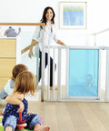 Vibe Mesh And Steel Baby Gate In Berry With Turnkey Mounts, visible between open staircase, children playing nearby