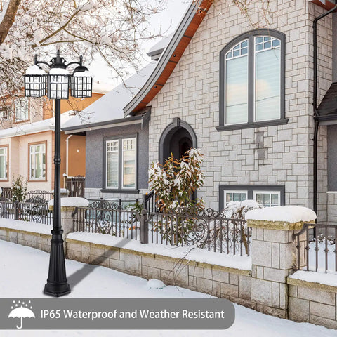 Three Head Outdoor Lamp Post Light Fixture With Dusk To Dawn Photocell Sensor in snowy yard next to brick house.