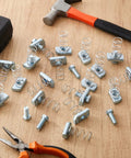 50 Piece 3/8-16 Spring Nut And Bolt Kit For Strut Channel Systems on wooden surface with tools