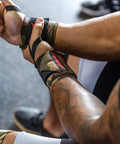 18 Inch Adjustable Weightlifting Wrist Wraps for Men and Women Pair in use at gym, showing stability and elastic support for powerlifting.