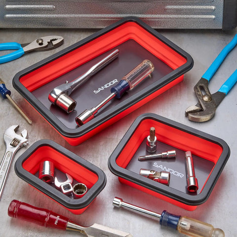 Three Size Collapsible Magnetic Parts Tray Set For Screws Bolts Nuts Washers Pins And Small Metal Parts, Non Marring Rubber Coated Magnets Protect Surfaces, Great Mechanic Gift For Men, Red, containing tools, on a workbench.