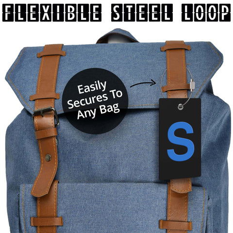 Initial Luggage Tag With Fully Bendable Design And Stainless Steel Loop attached to a blue backpack showing ease of securing to bags.