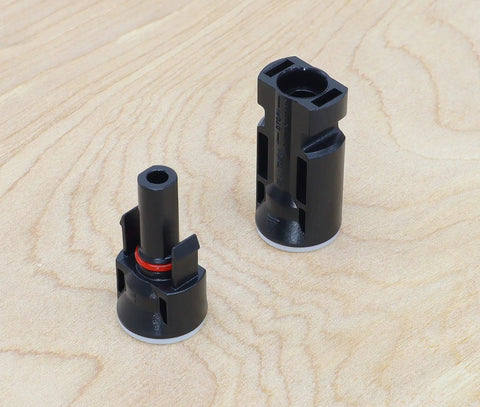 Heavy Duty Solar Bulkhead Connector Pair MC4 30A 1000V IP67 Black Waterproof connectors on wooden background