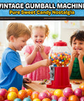 Kids enjoying colorful treats from a Killer Vintage Style Red Cast Metal 11 Inch Self Serve Gumball Candy Dispenser.
