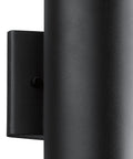 Close-up of textured black 12 inch outdoor wall sconce cylinder exterior LED light 1 light front porch fixture.