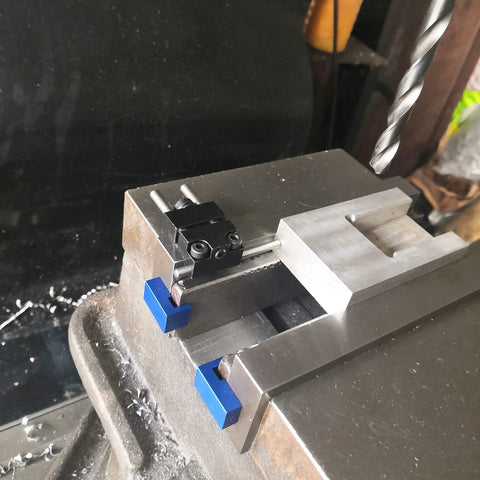Magnetic Parallel Keepers for Vise and CNC Machining with blue powder-coated aluminum, ultra-strong rare earth magnets in use on a vise.
