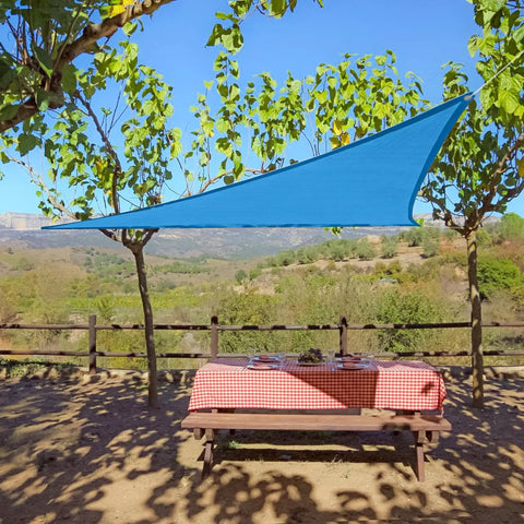 Triangle Shade Sail 9 ft 10 in Outdoor Sun Shade Breathable UV Blocking Canopy in Blue Lightweight and Portable for Backyards Patios and Casual Hangouts over picnic table