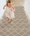 Child running on stairs with Non Slip Stair Treads For Wooden Steps 28x9In Beige Soft Polyester Carpet With Self Adhesive Backing 15 Pack