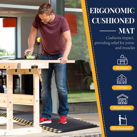 Heavy-Duty Anti-Fatigue Standing Mat 39 By 20 Inches With Safety Yellow Border Built For Long Shifts Ergonomic Cushioning To Relieve Back And Leg Pain In Warehouse Garage Kitchen And Workshop shown in workshop setting.