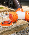RhinoFlex Clear RV Sewer Hose Elbow With 4 In 1 Adapter Odor Tight Seal And 360 Degree Rotating Fitting Built In Gasket For Odor Proof Connection Fits Four Dump Station Inlets For Easy Leak Free RV Waste Hose Setup, clear orange elbow on RV sewer hose