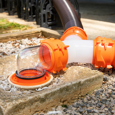 RhinoFlex Clear RV Sewer Hose Elbow With 4 In 1 Adapter Odor Tight Seal And 360 Degree Rotating Fitting Built In Gasket For Odor Proof Connection Fits Four Dump Station Inlets For Easy Leak Free RV Waste Hose Setup, clear orange elbow on RV sewer hose